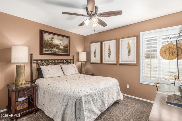 a bedroom with a large bed and a window