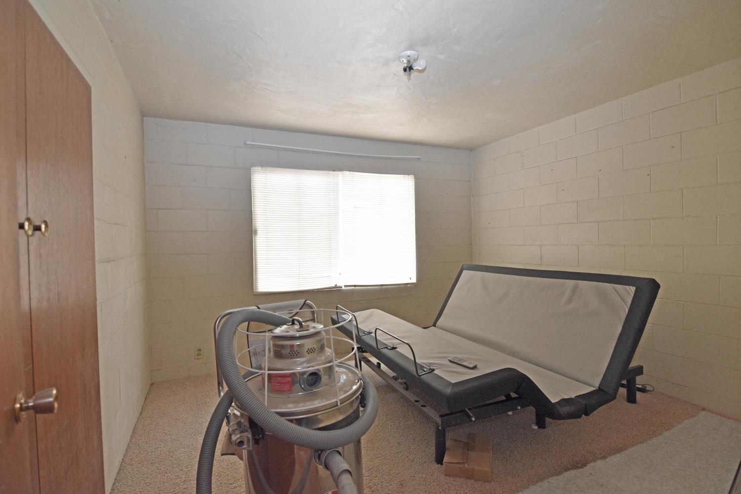 1206 South Verduga Road Turlock, CA 95380 - Photo 17 of 36 a room with furniture and a window