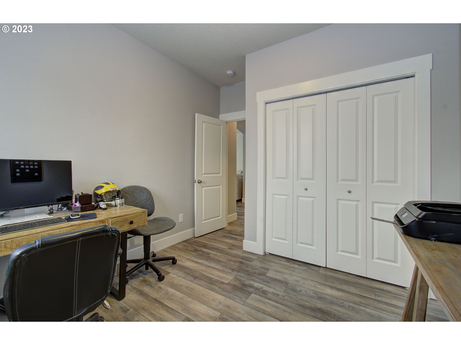 871 North 35th Avenue Ridgefield, WA 98642 - Photo 11 of 36 a room with a wooden floor and furniture