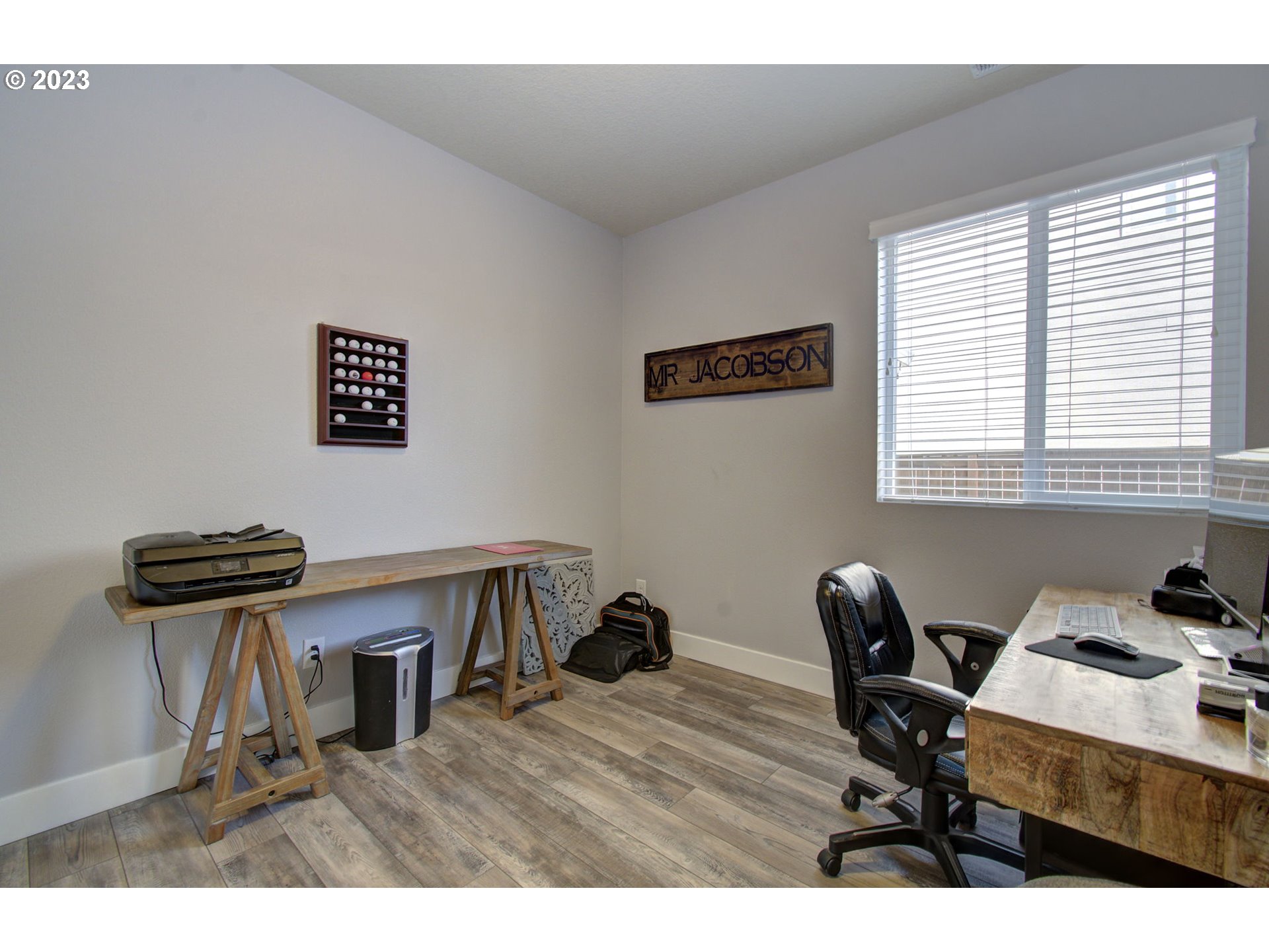 871 North 35th Avenue Ridgefield, WA 98642 - Photo 12 of 36 a view of a workspace with furniture and a window