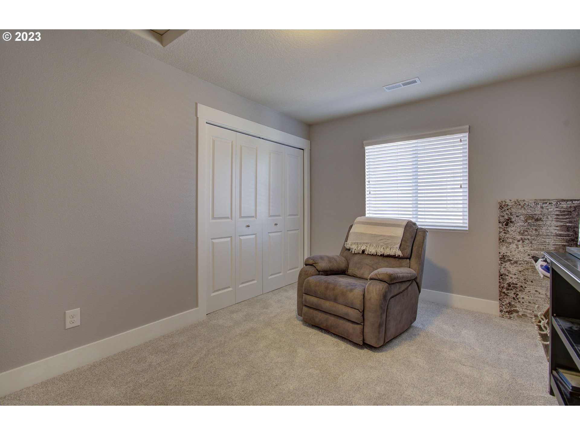 871 North 35th Avenue Ridgefield, WA 98642 - Photo 26 of 36 a living room with furniture and a fireplace