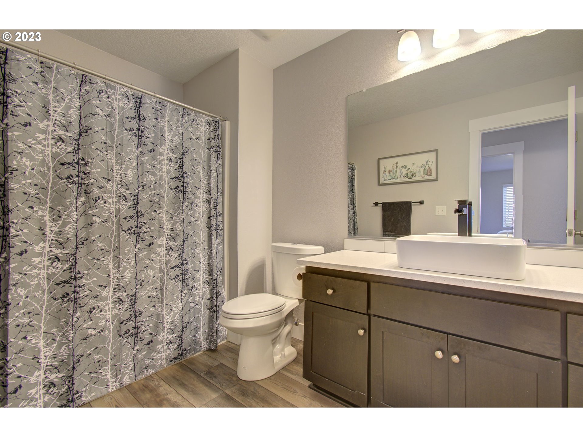 871 North 35th Avenue Ridgefield, WA 98642 - Photo 29 of 36 a bathroom with a toilet sink and mirror