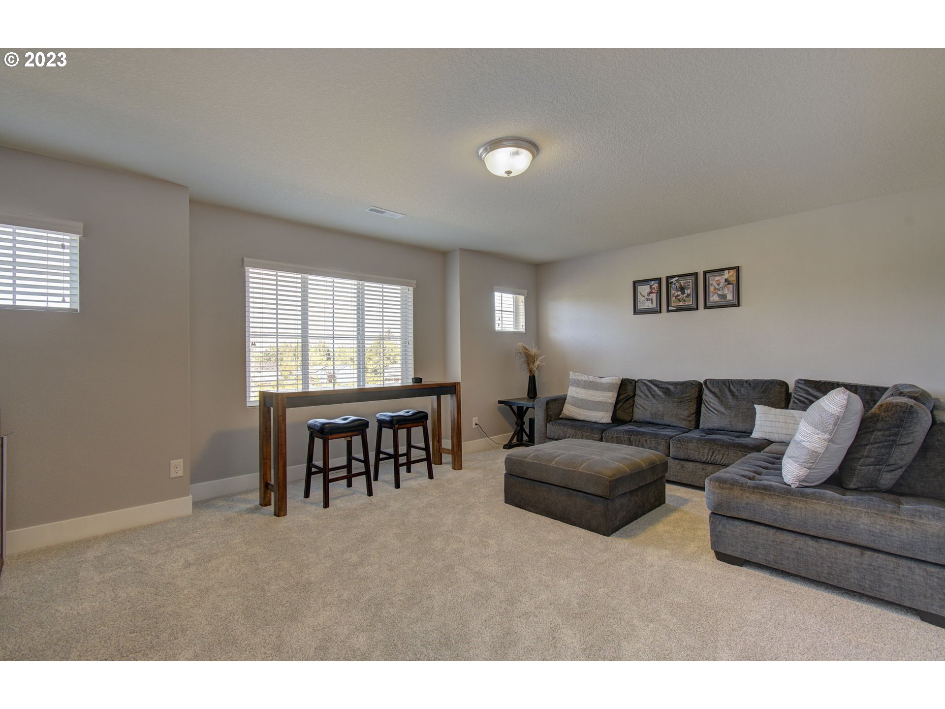 871 North 35th Avenue Ridgefield, WA 98642 - Photo 30 of 36 a living room with furniture and a window