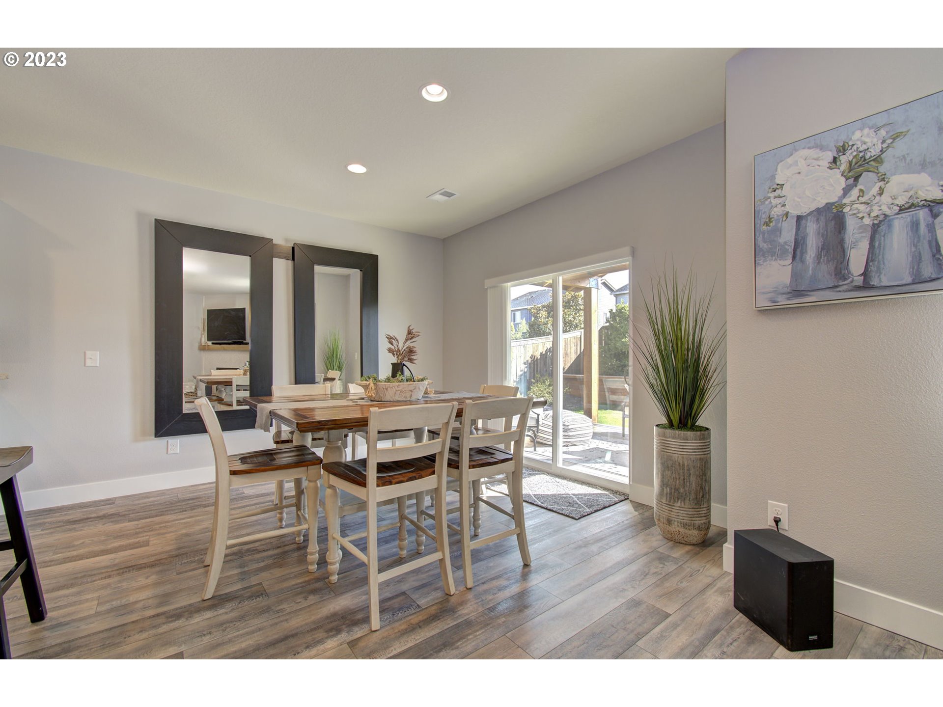 871 North 35th Avenue Ridgefield, WA 98642 - Photo 10 of 36 a dining room with furniture and wooden floor