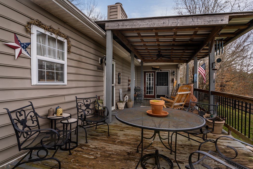 112 Deer Ridge Drive Murphy, NC 28906 - Photo 16 of 55 a table and chairs in front of a house