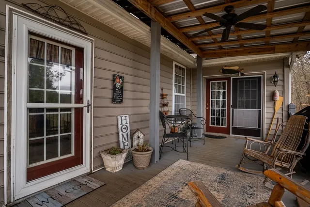 a view of a chairs and table on the deck