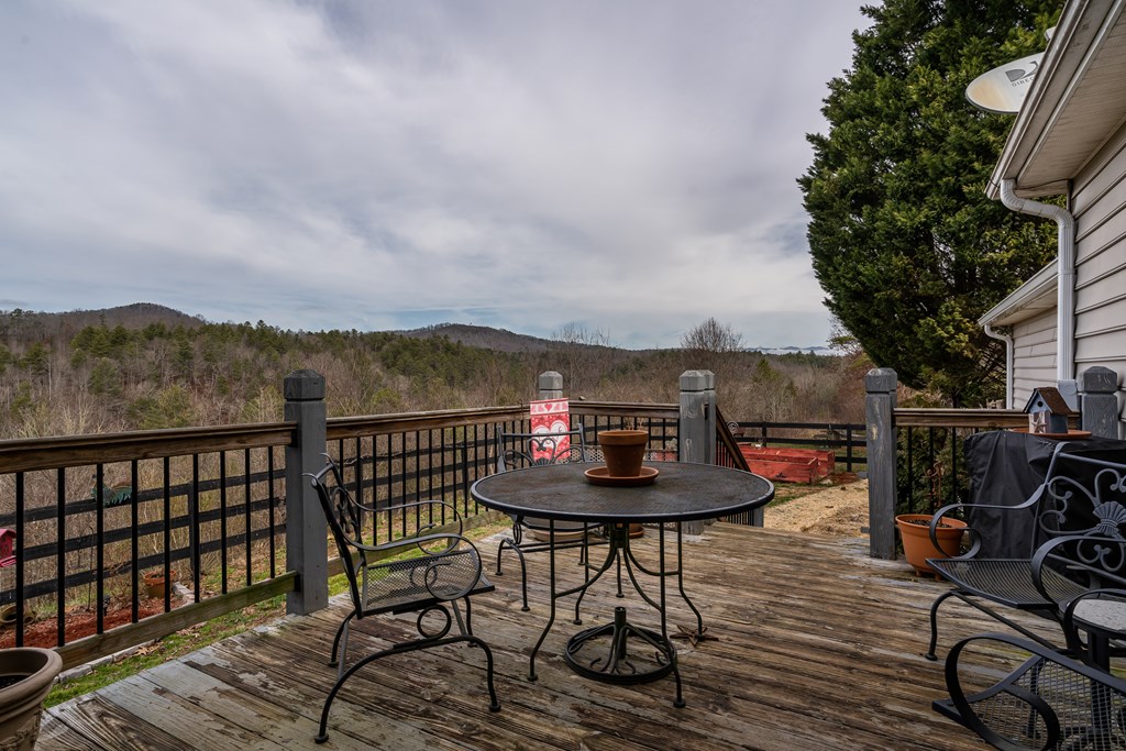 112 Deer Ridge Drive Murphy, NC 28906 - Photo 19 of 55 a view of a chairs and table on the deck