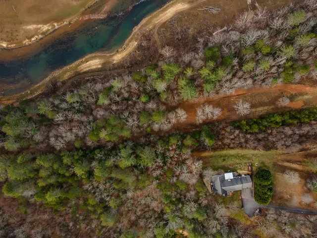 a view of a lake with a yard