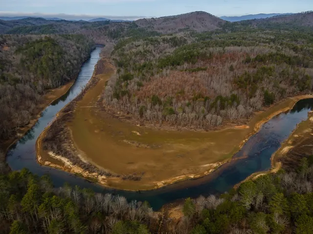 a view of a lake with a yard