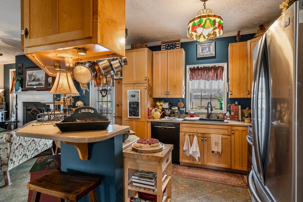 112 Deer Ridge Drive Murphy, NC 28906 - Photo 36 of 55 a kitchen with stainless steel appliances a stove a refrigerator and a sink