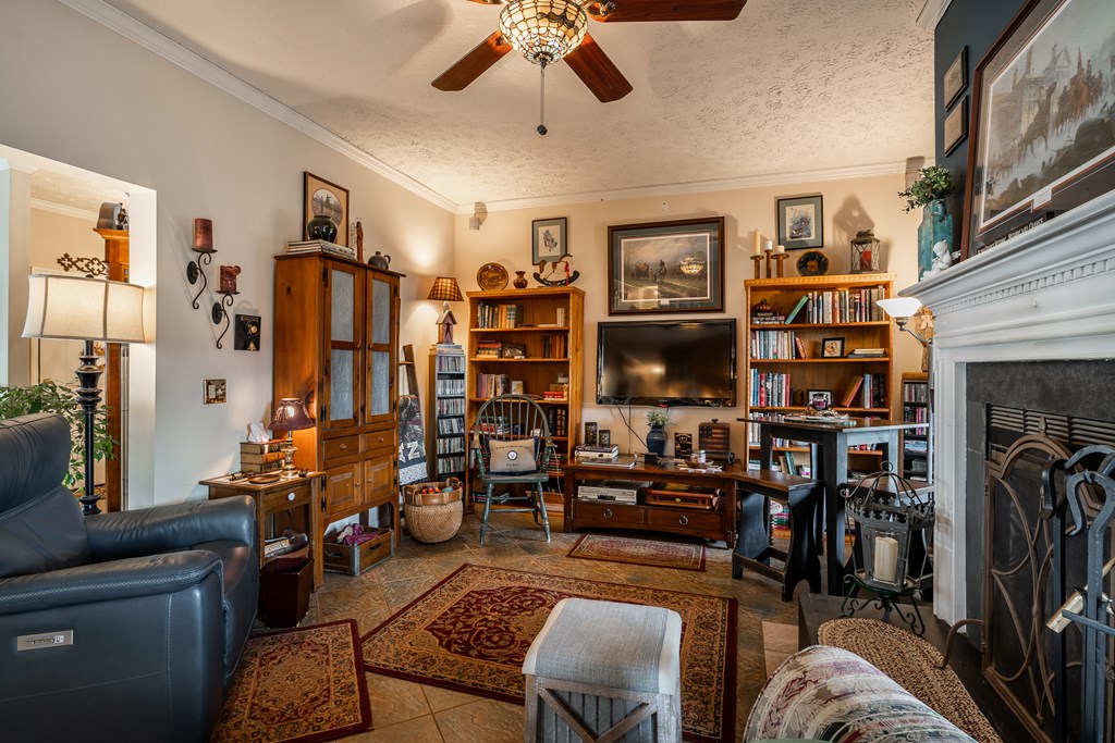 112 Deer Ridge Drive Murphy, NC 28906 - Photo 39 of 55 a living room with lots of furniture and gym equipment