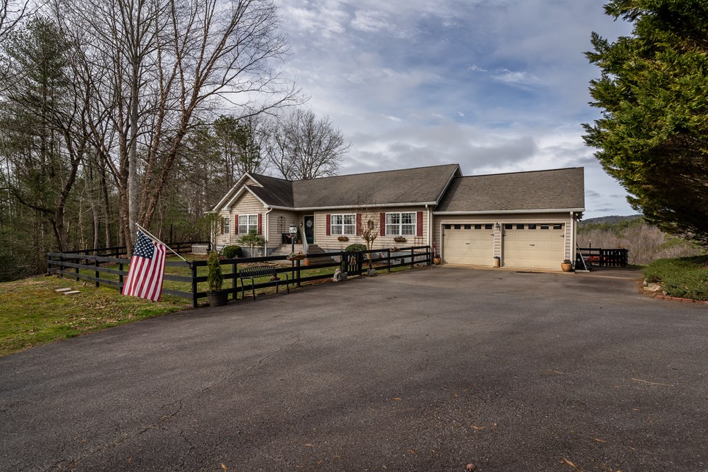 112 Deer Ridge Drive Murphy, NC 28906 - Photo 4 of 55 a view of a house with large trees and wooden fence