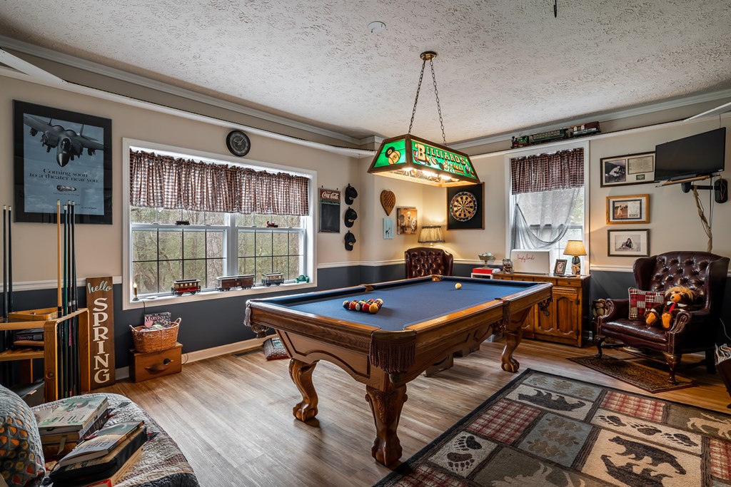 112 Deer Ridge Drive Murphy, NC 28906 - Photo 43 of 55 a living room with furniture a window and gym equipment