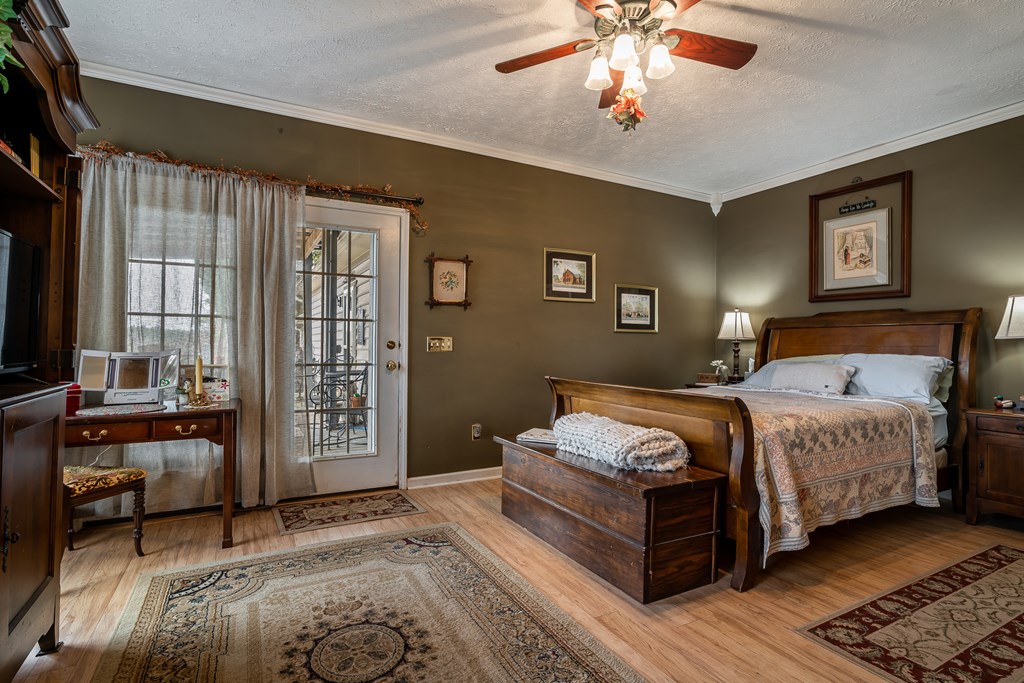 112 Deer Ridge Drive Murphy, NC 28906 - Photo 46 of 55 a bedroom with a large bed and a chandelier