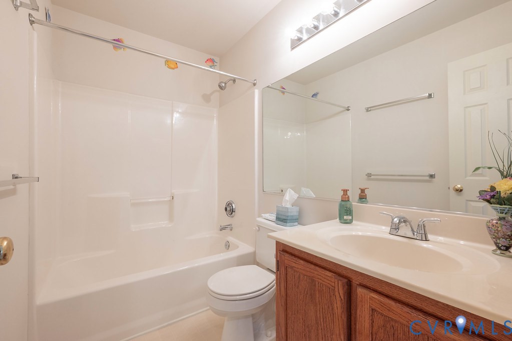 6332 Springcrest Lane Richmond, VA 23231 - Photo 25 of 38 a bathroom with a sink toilet vanity and shower