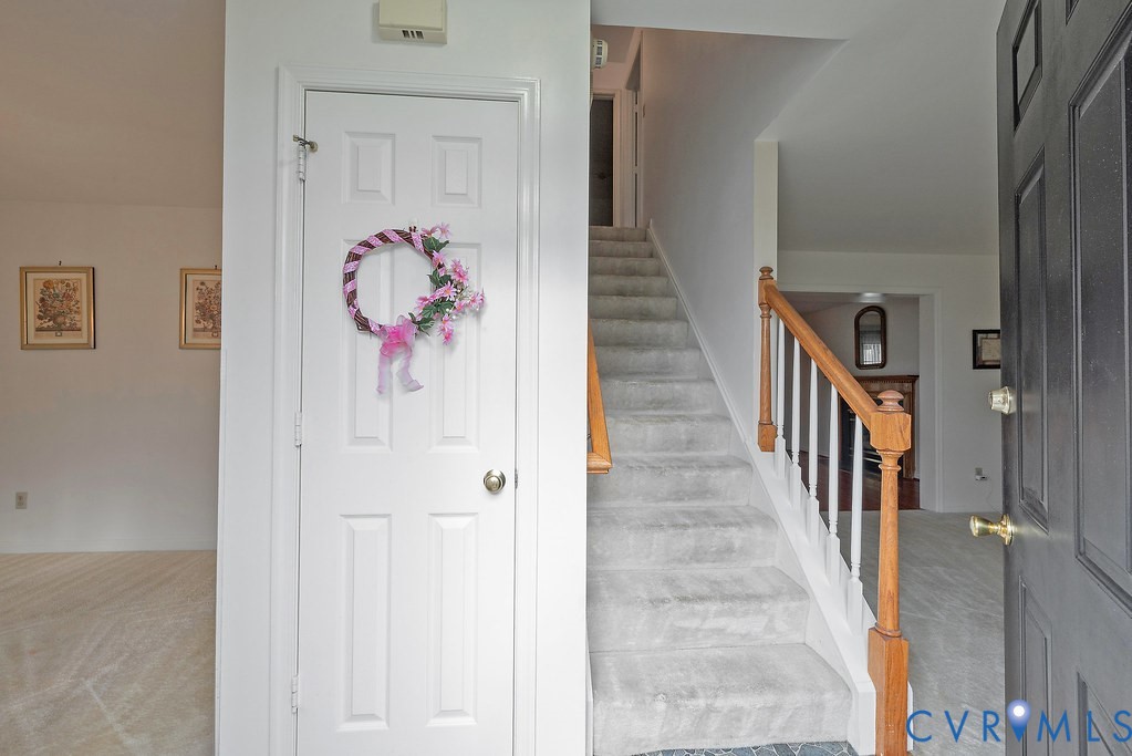 6332 Springcrest Lane Richmond, VA 23231 - Photo 3 of 38 a view of a hallway with wooden floor and entryway