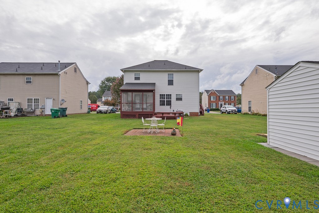 6332 Springcrest Lane Richmond, VA 23231 - Photo 36 of 38 a view of a house with a yard and sitting area