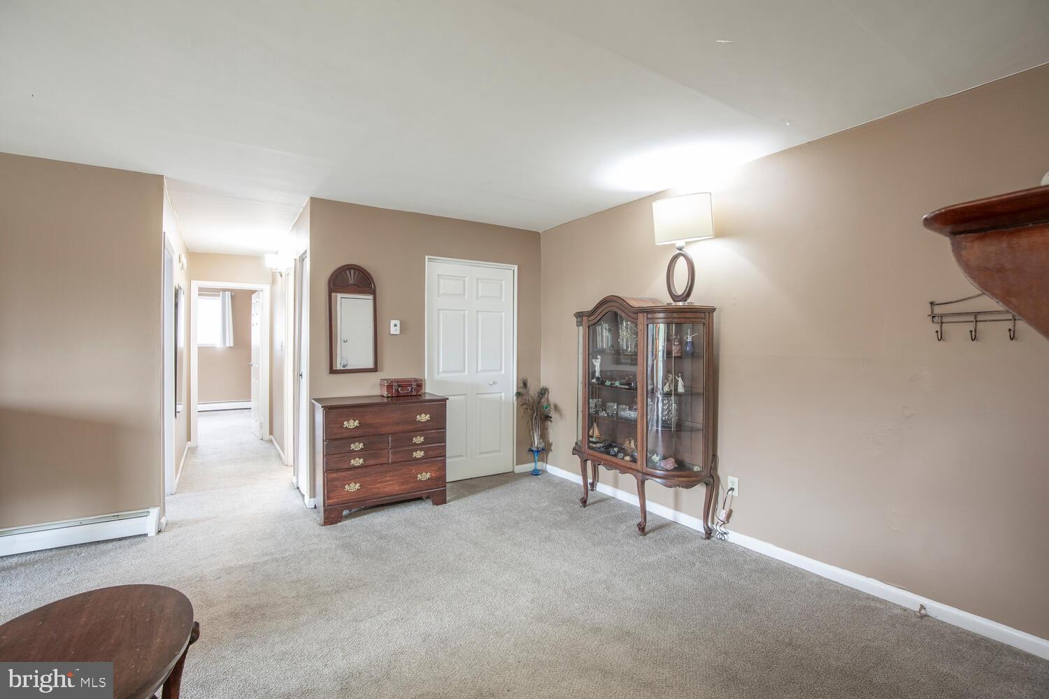 1575 West Street Road, Unit 626 Warminster, PA 18974 - Photo 11 of 22 a view of a livingroom with furniture and a chandelier