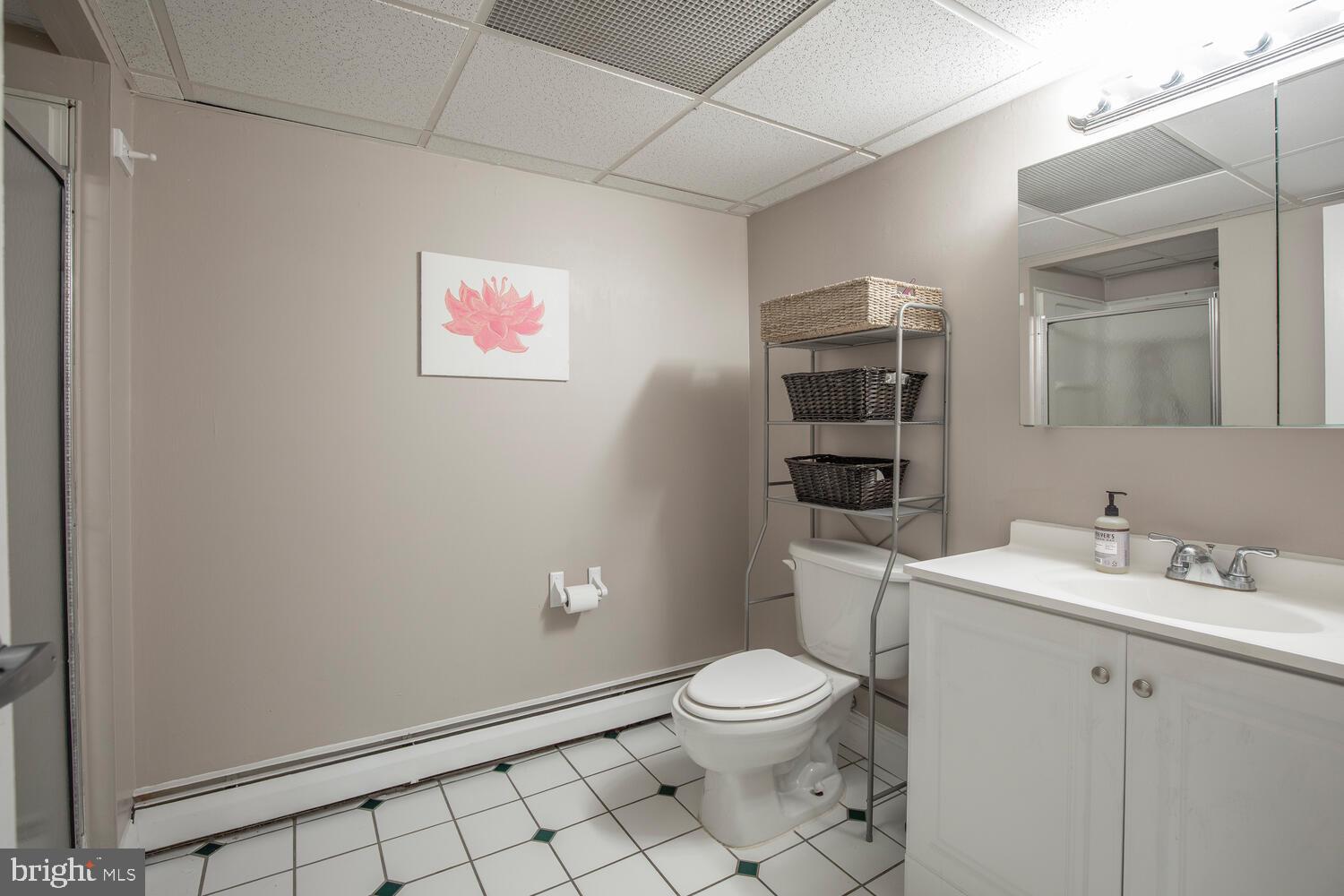 1575 West Street Road, Unit 626 Warminster, PA 18974 - Photo 19 of 22 a bathroom with a toilet sink and mirror