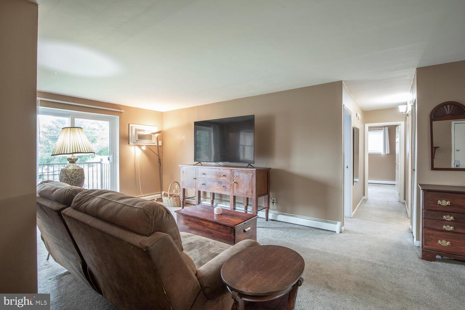 1575 West Street Road, Unit 626 Warminster, PA 18974 - Photo 10 of 22 a living room with furniture and a flat screen tv