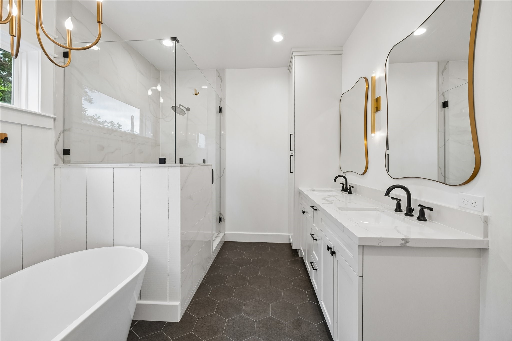 1205 Temple Street Houston, TX 77009 - Photo 21 of 33 Inspired by boutique hotels, the spa-like primary bath offers dual vanities, a freestanding soaking tub, and an oversized walk-in shower designed for everyday luxury.