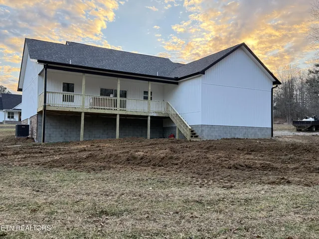a front view of a house with garage