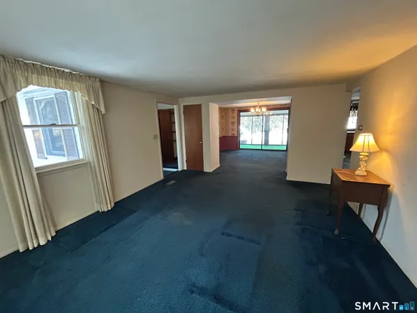 a view of hall way with furniture