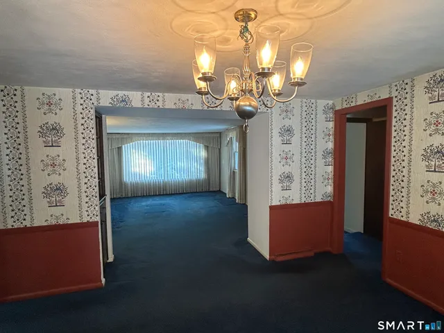 an empty room with windows and outdoor view