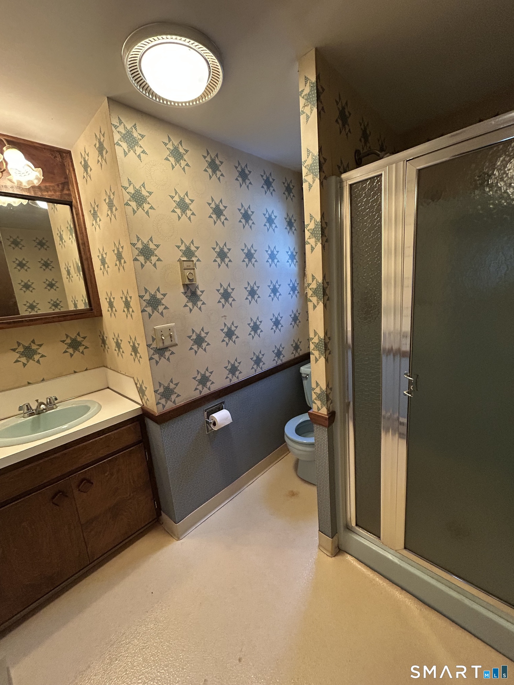 65 Munson Road Wolcott, CT 06716 - Photo 21 of 28 a bathroom with a sink mirror and a shower