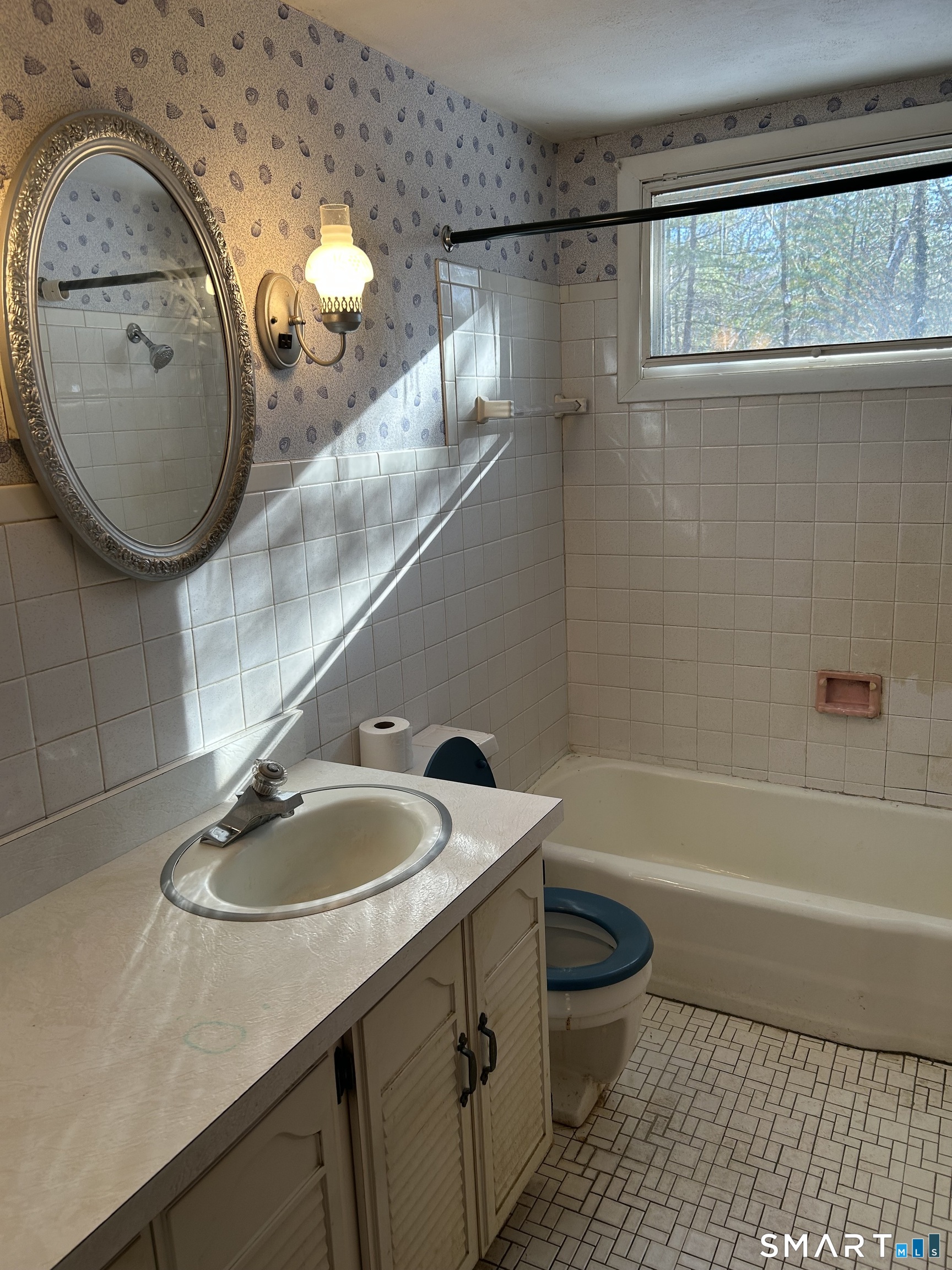 65 Munson Road Wolcott, CT 06716 - Photo 23 of 28 a bathroom with a granite countertop sink mirror vanity and toilet
