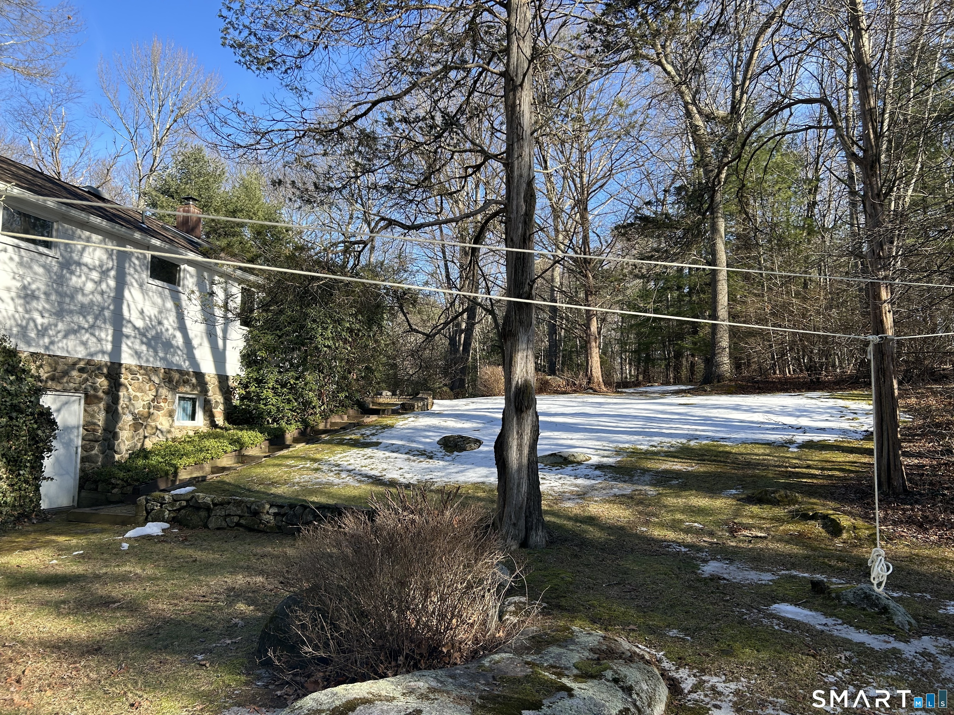 65 Munson Road Wolcott, CT 06716 - Photo 7 of 28 a view of a lake with a house in the background