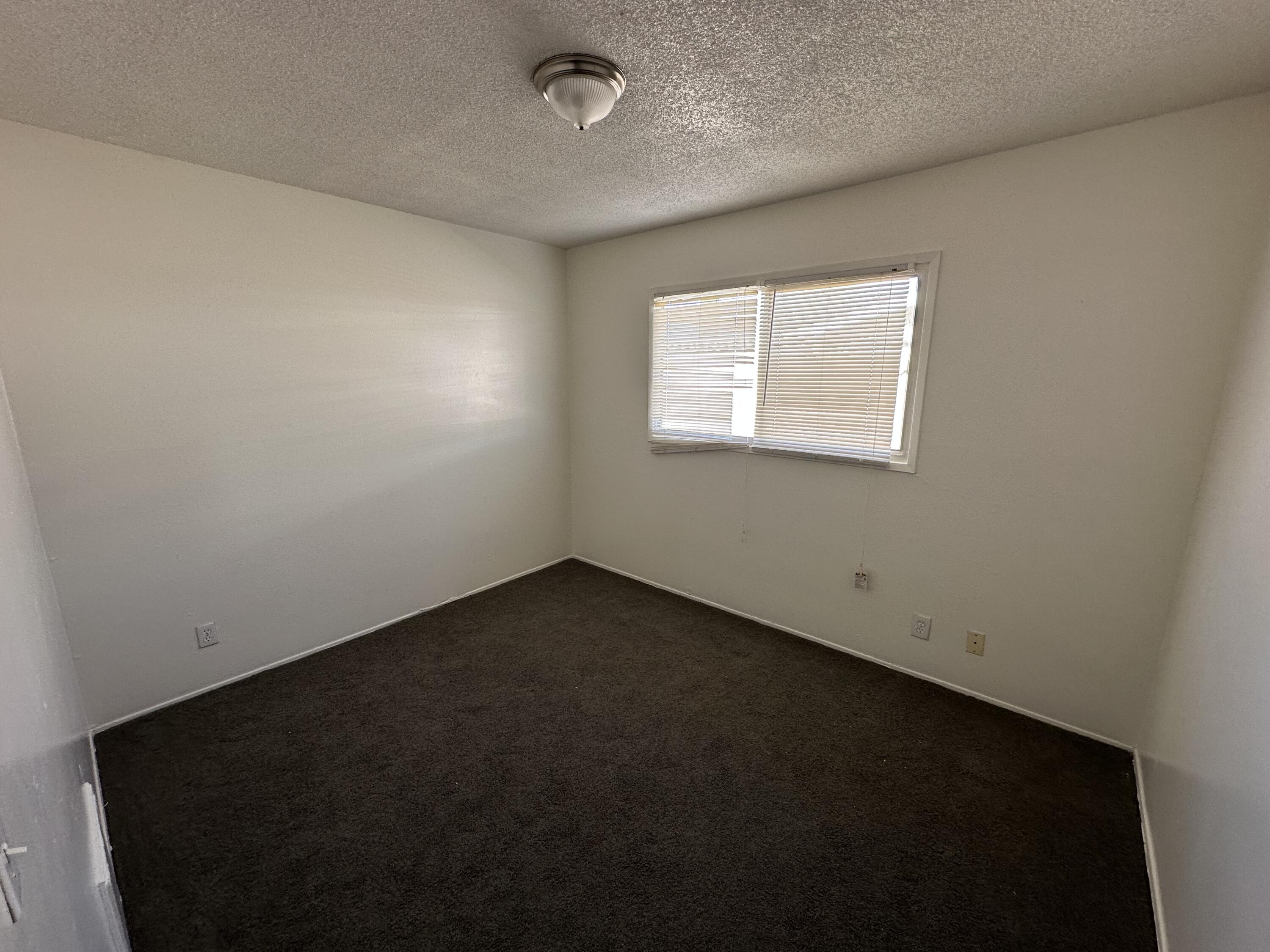 45433 Lorimer Avenue Lancaster, CA 93534 - Photo 15 of 23 an empty room with a empty space and a window