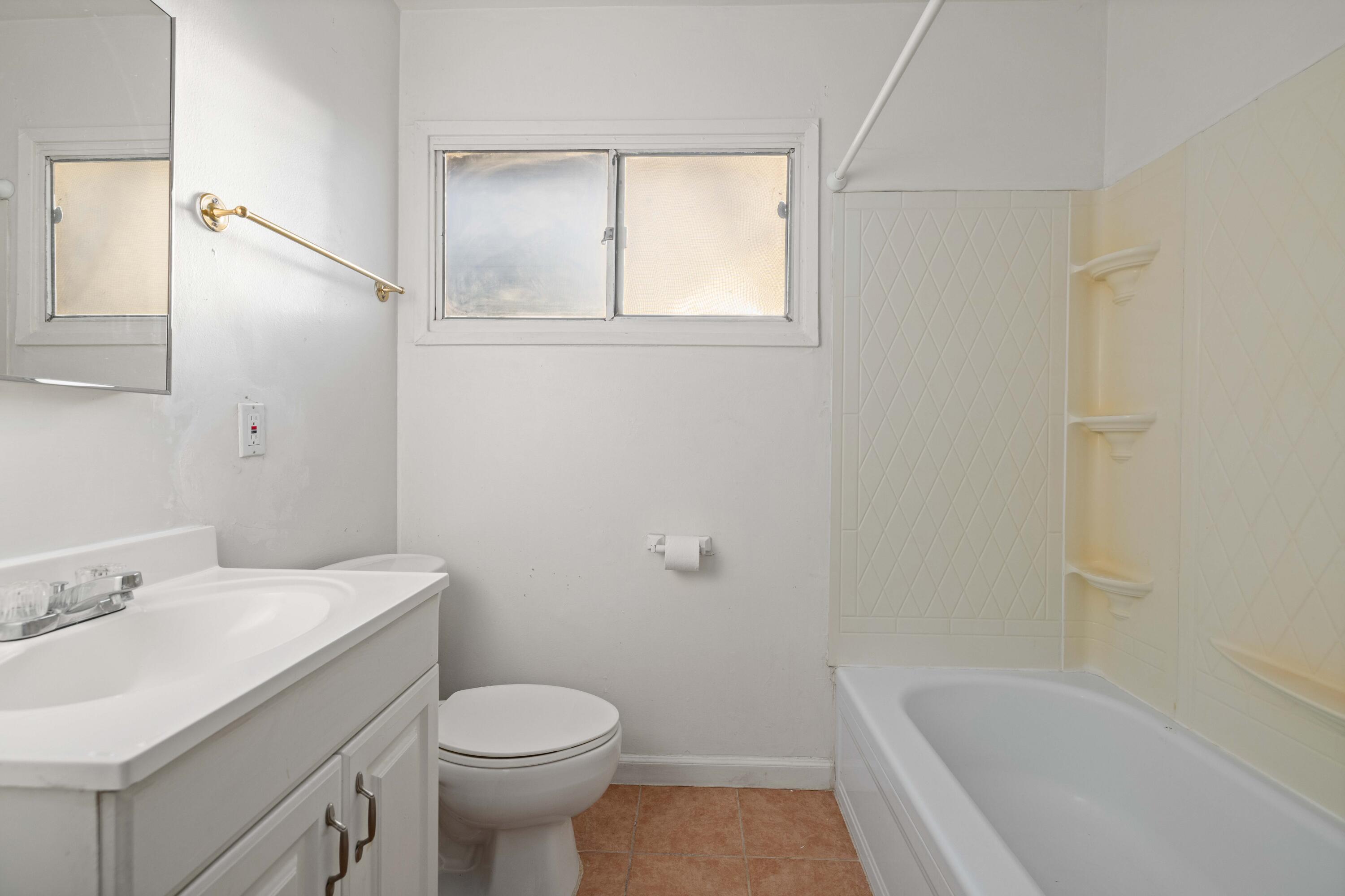 45433 Lorimer Avenue Lancaster, CA 93534 - Photo 16 of 23 a bathroom with a sink toilet and bathtub