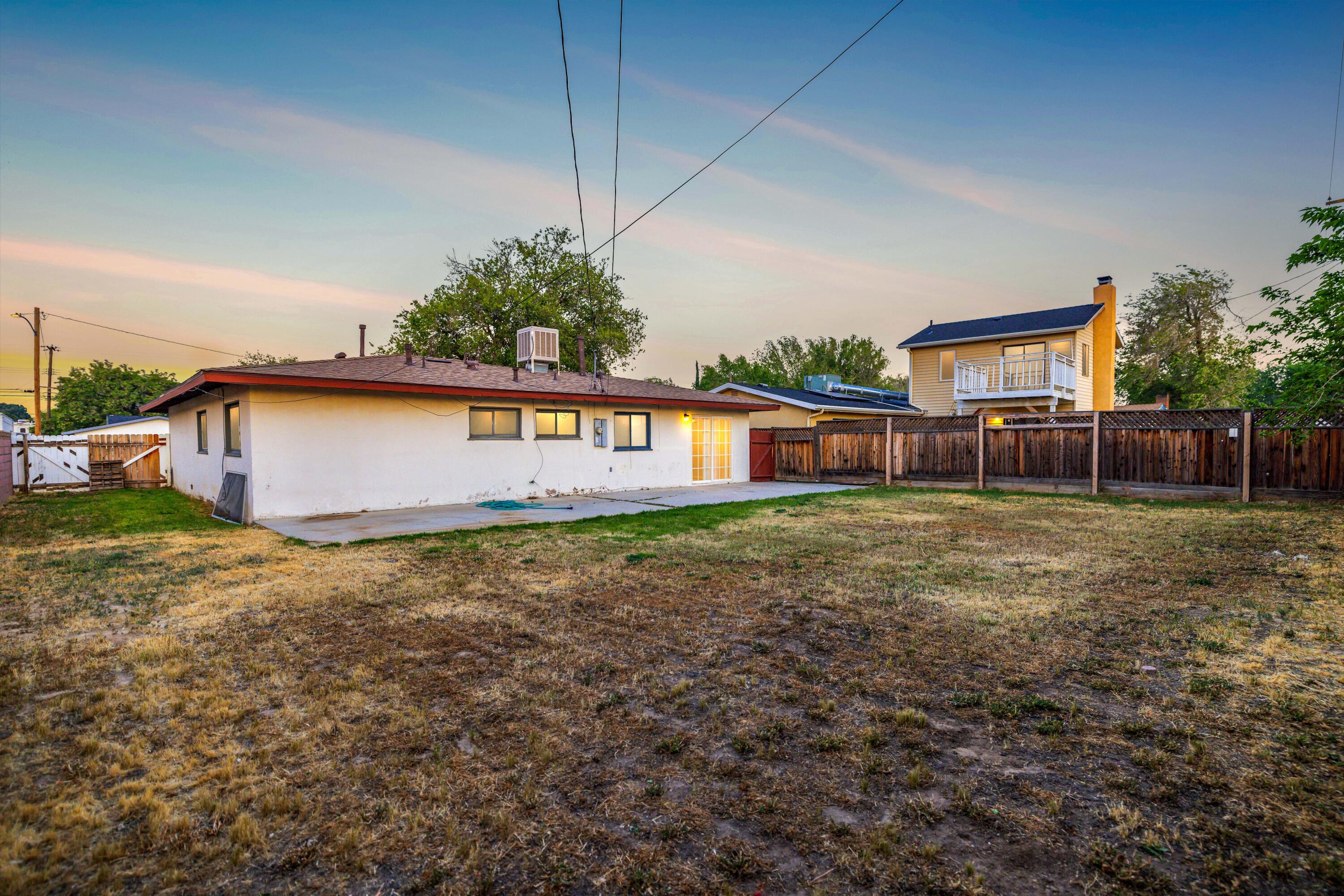 45433 Lorimer Avenue Lancaster, CA 93534 - Photo 19 of 23 a view of a house with a yard