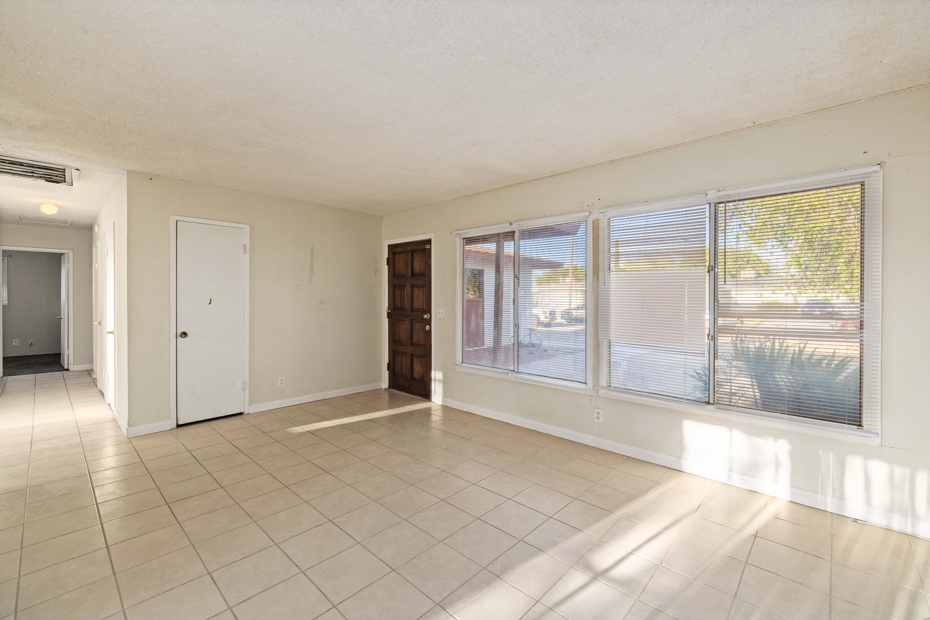45433 Lorimer Avenue Lancaster, CA 93534 - Photo 7 of 23 a view of an empty room with glass door