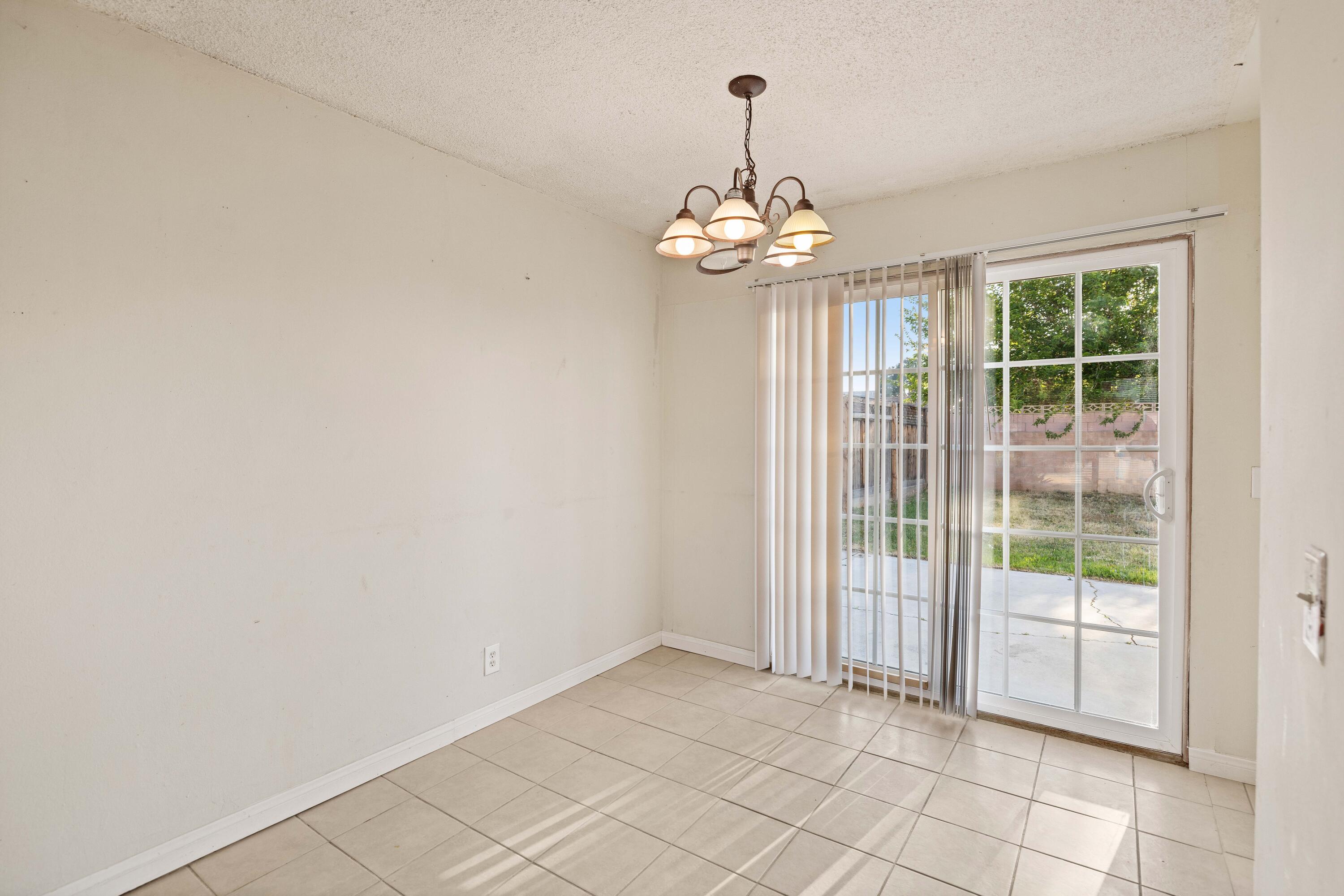 45433 Lorimer Avenue Lancaster, CA 93534 - Photo 8 of 23 a view of an empty room with a window