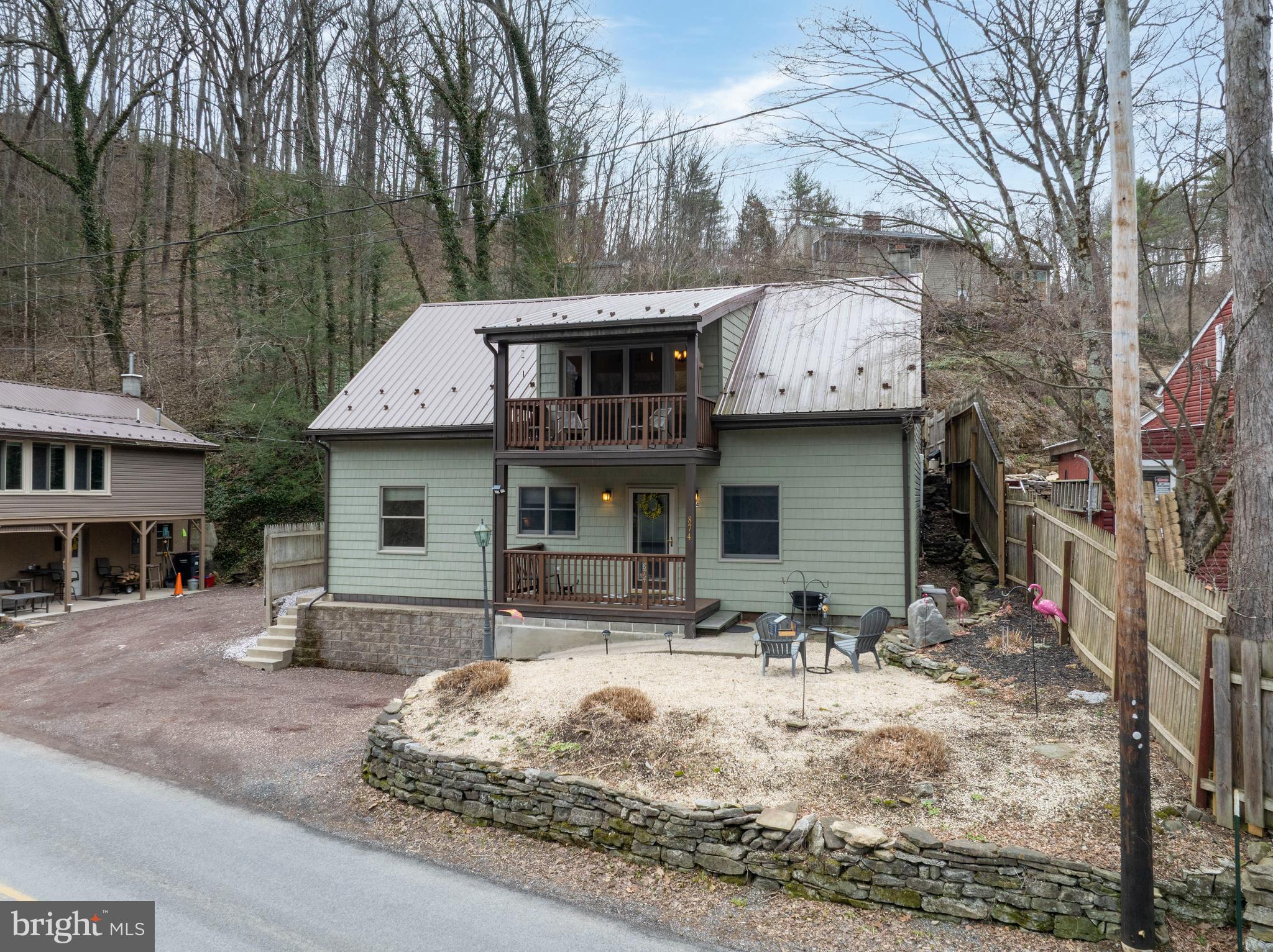 874 Spring Creek Road Bellefonte, PA 16823 - Photo 1 of 45 a view of a house with large windows