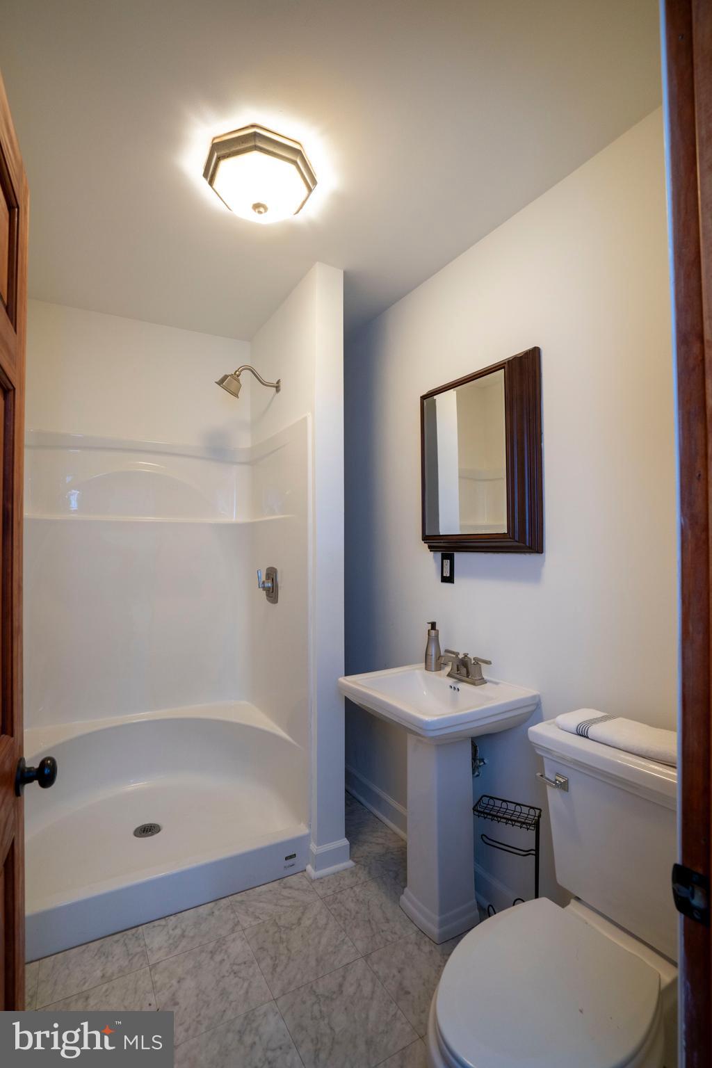 874 Spring Creek Road Bellefonte, PA 16823 - Photo 17 of 45 a bathroom with a sink toilet and shower