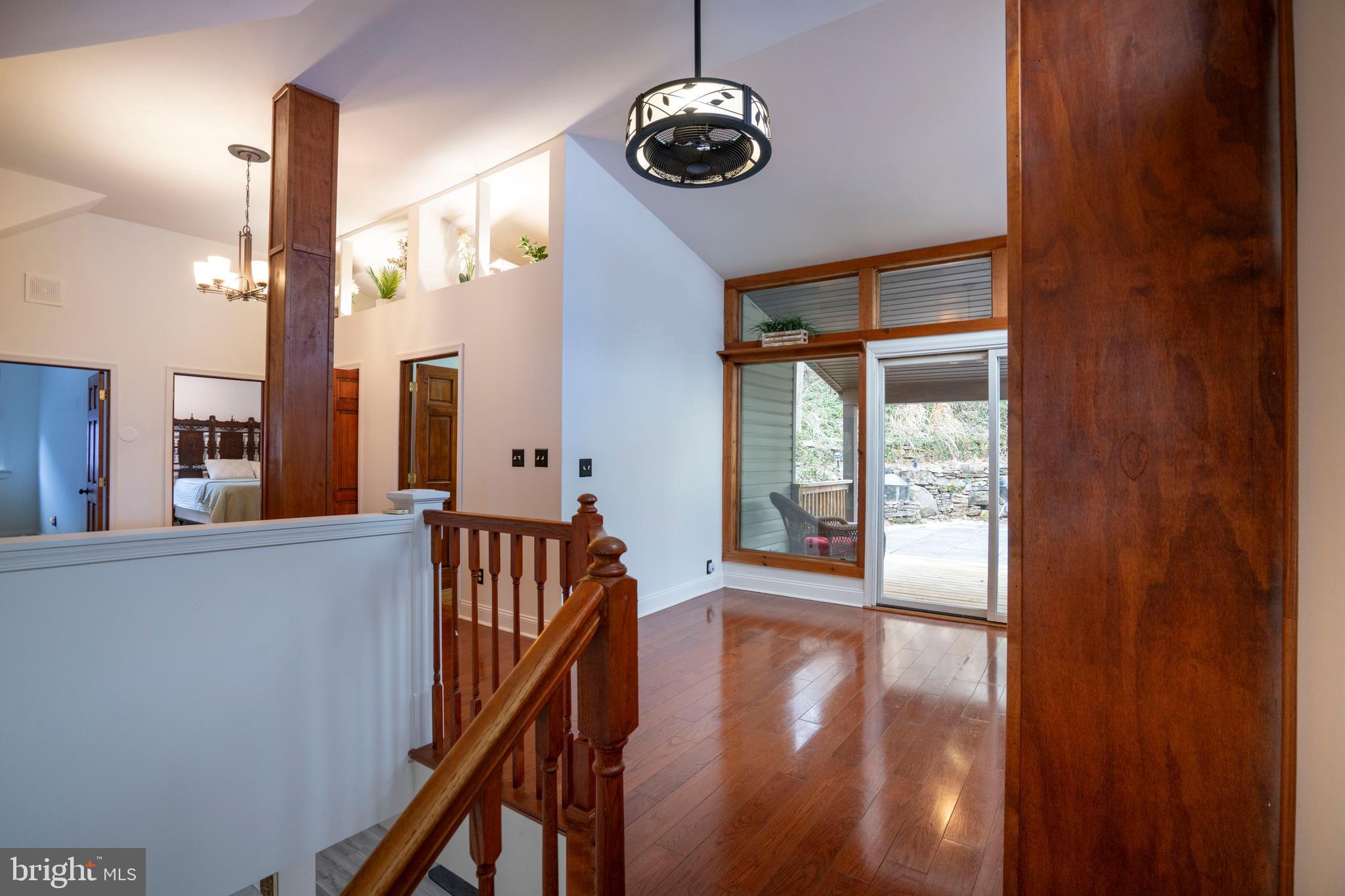 874 Spring Creek Road Bellefonte, PA 16823 - Photo 19 of 45 a view of a hallway with wooden floor and windows