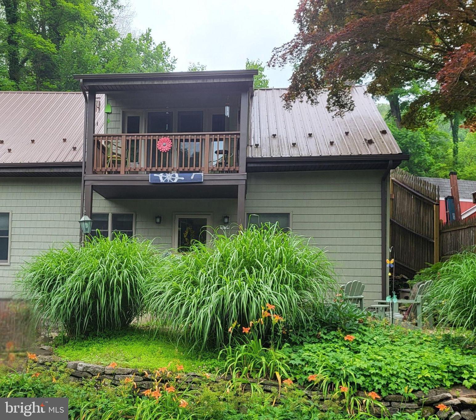 874 Spring Creek Road Bellefonte, PA 16823 - Photo 3 of 45 a front view of a house with garden