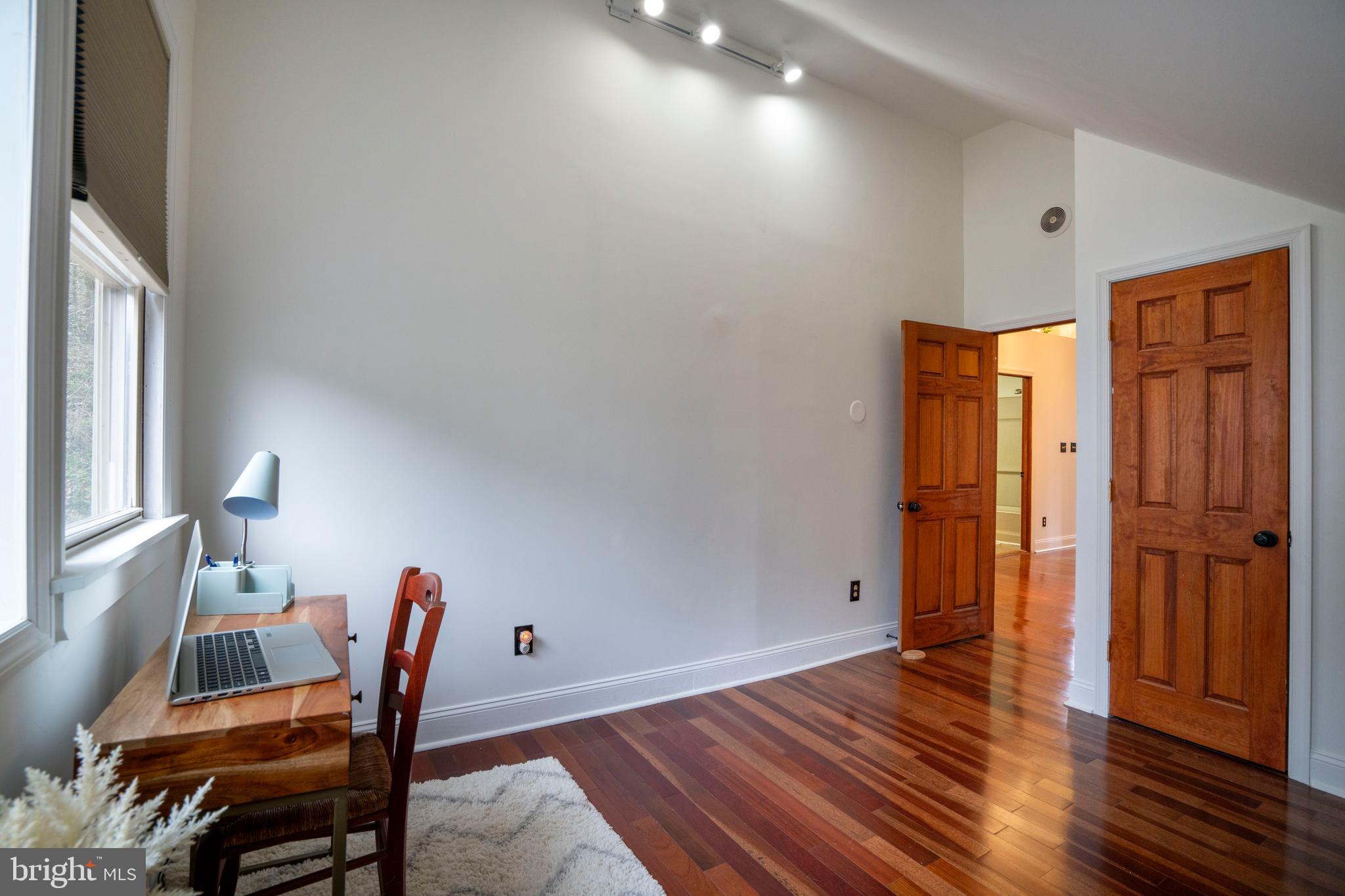 874 Spring Creek Road Bellefonte, PA 16823 - Photo 38 of 45 a view of a room with wooden floor and chair