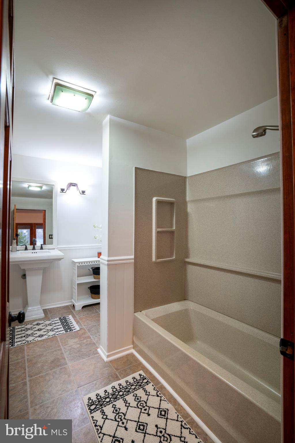 874 Spring Creek Road Bellefonte, PA 16823 - Photo 39 of 45 a bathroom with a bathtub and a shower