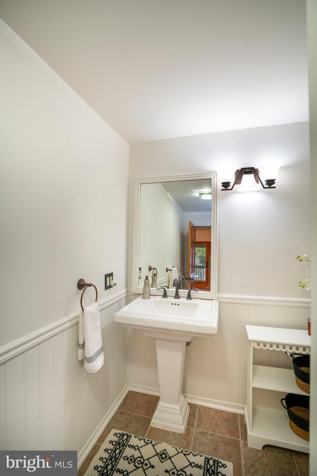 874 Spring Creek Road Bellefonte, PA 16823 - Photo 40 of 45 a bathroom with a sink toilet and mirror