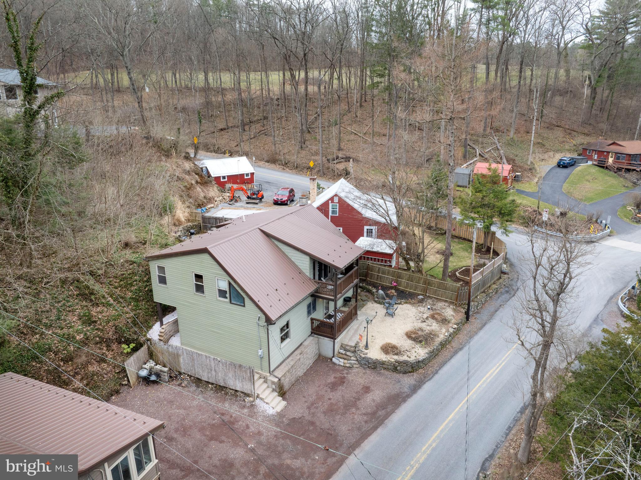 874 Spring Creek Road Bellefonte, PA 16823 - Photo 45 of 45 a view of a house with a backyard and sitting area