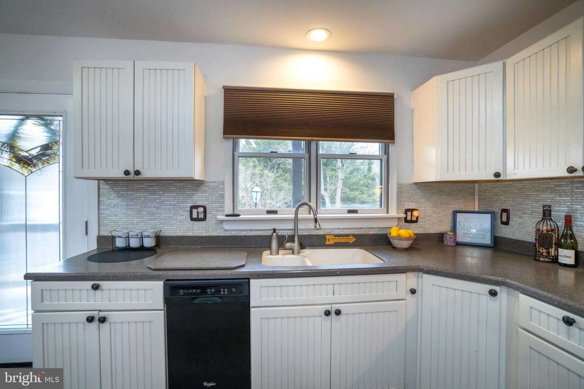 874 Spring Creek Road Bellefonte, PA 16823 - Photo 8 of 45 a kitchen with a sink a window and cabinets