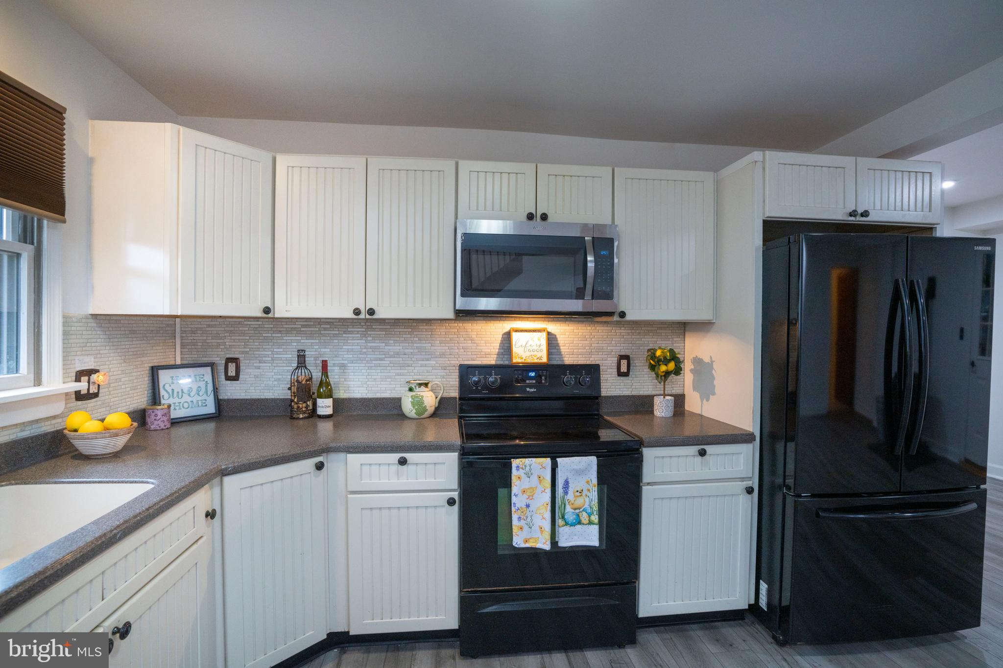 874 Spring Creek Road Bellefonte, PA 16823 - Photo 9 of 45 a kitchen with stainless steel appliances a stove refrigerator sink and cabinets
