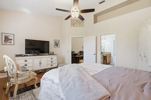 a view of a livingroom with furniture and a flat screen tv
