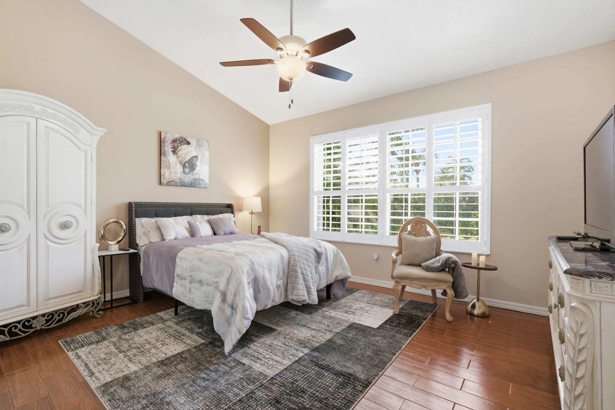 1632 Southwest Harbour Isles Circle, Unit 88 Port St. Lucie, FL 34986 - Photo 15 of 36 a bed room with a bed and a couch