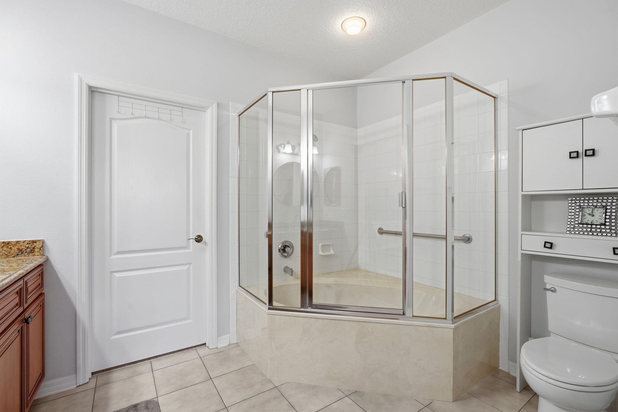 1632 Southwest Harbour Isles Circle, Unit 88 Port St. Lucie, FL 34986 - Photo 17 of 36 a bathroom with a shower a toilet and sink