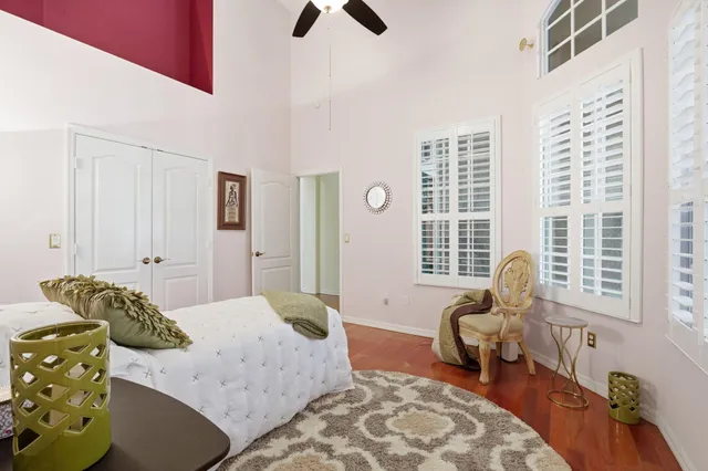 a bedroom with furniture and a window